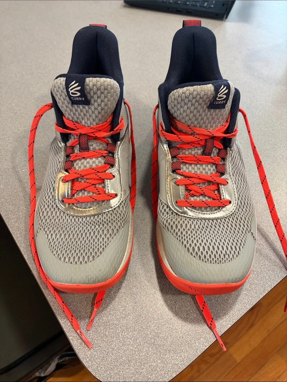 Under Armour Steph Curray Grey Athletic Shoes with Red Accents
